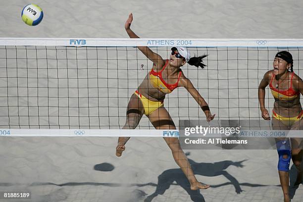 Beach Volleyball: 2004 Summer Olympics, China Tian Jia in action with teammate Wang Fei during Preliminary Round at Olympic Beach Volleyball Centre...