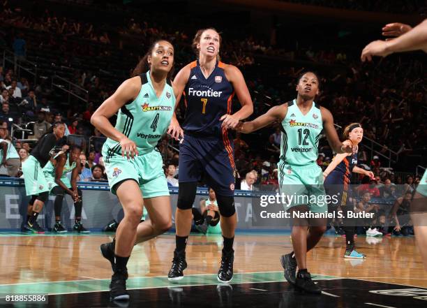 Kayla Pedersen of the Connecticut Sun plays defense against Nayo Raincock-Ekunwe and Lindsay Allen of the New York Liberty on July 19, 2017 at...
