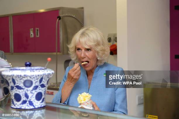 Camilla, Duchess of Cornwall samples a tub of ice cream during a visit to Caterlink, in Bodmin, a Cornish business specialising in ice cream cones,...