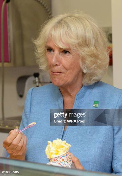 Camilla, Duchess of Cornwall samples a tub of ice cream during a visit to Caterlink, in Bodmin, a Cornish business specialising in ice cream cones,...