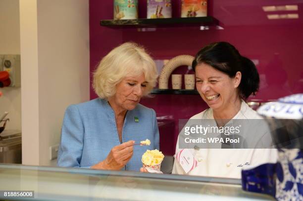 Camilla, Duchess of Cornwallwith technical demonstrator Anna Menini, as she samples a tub of ice cream during a visit to Caterlink, in Bodmin, a...