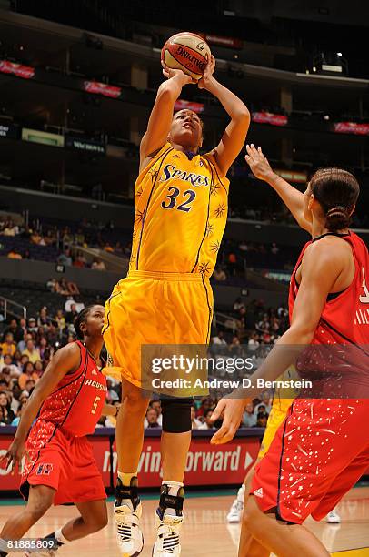 Christi Thomas of the Los Angeles Sparks shoots for two points over Mistie Williams of the Houston Comets during the game at Staples Center July 9,...