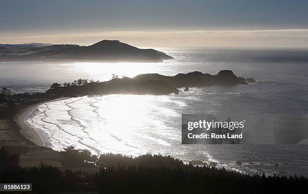 Early morning sun reflects off the ocean at Karatane on July 10, 2008 in Dunedin, New Zealand. Much of Dunedin was covered by frost after overnight...