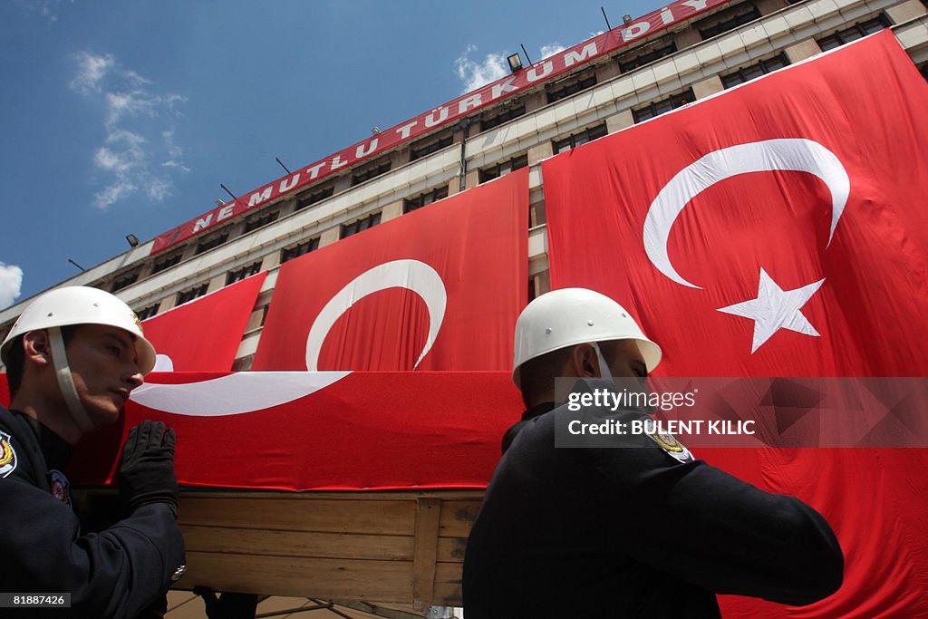 Turkish police officer carry on July 10,