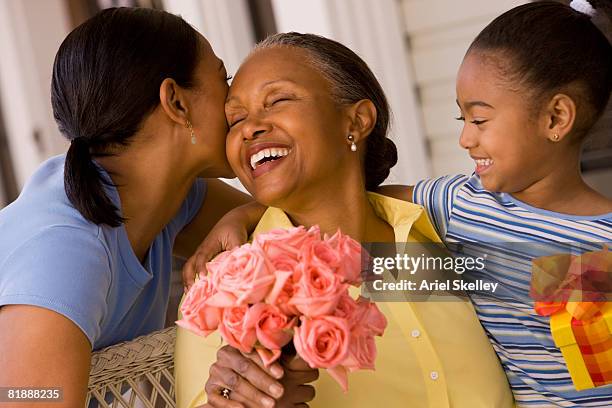 mother, daughter, and grandmother celebrating mother's day - african gift stock pictures, royalty-free photos & images