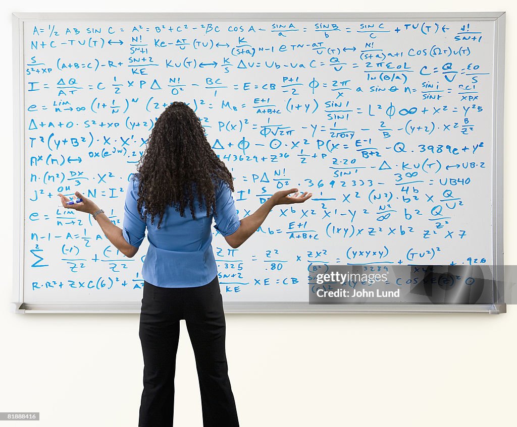 Woman In Front of Large Math Problem