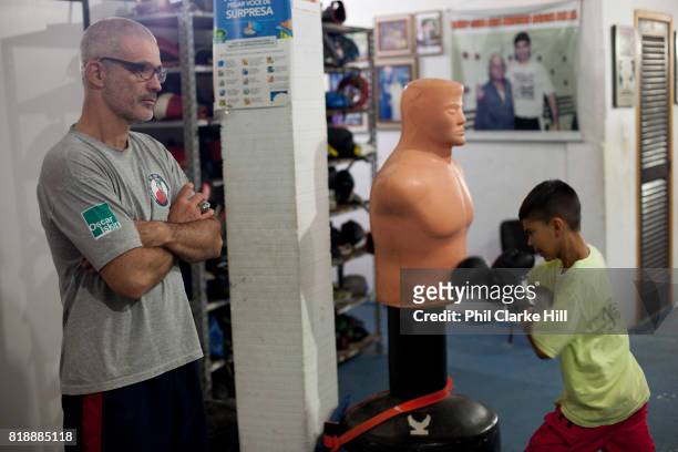 Children, young men training at Boxing school Instituto Todos Na Luta , set up by Raff Giglio in Vidigal. Since pacification in 2011, Vidigal has...