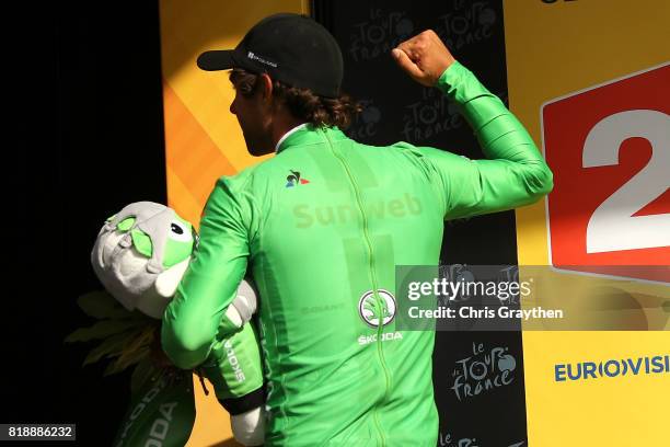 Michael Matthews of Australia riding for Team Sunweb celebrates on the podium after taking the green points jersey during stage 17 of the 2017 Le...