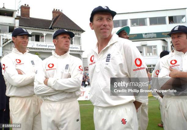 England captain Mike Atherton and other England players watch an interruption to the presentation ceremony after Australia defeated England by 7...