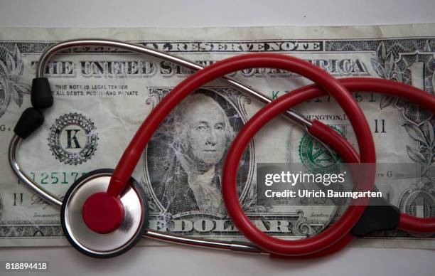 Symbol photo on the subject health reform in the United States of America . The photo shows a stethoscope on a dollar banknote.