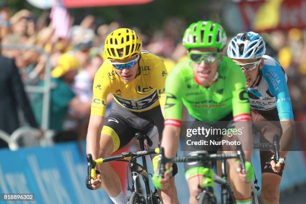 Great Britain's Christopher Froome wearing the overall leader's yellow jersey, France's Romain Bardet and Colombia's Rigoberto Uran ride towards the...