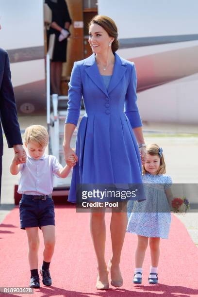 Catherine, Duchess of Cambridge, Prince George of Cambridge and Princess Charlotte of Cambridge arrive at Berlin military airport during an official...