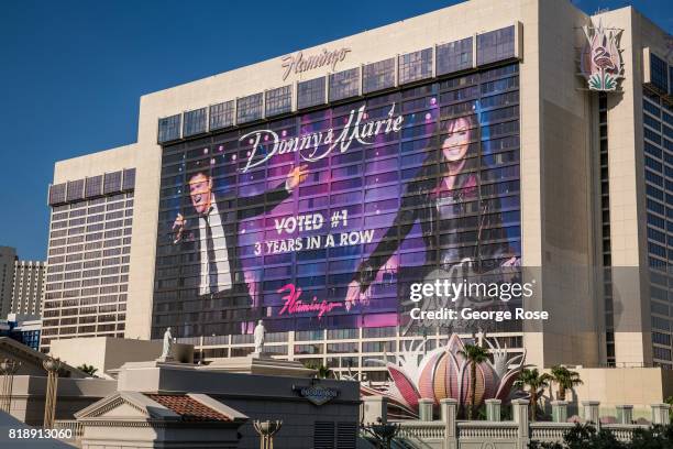 Large billboard promoting the Donny & Marie Osmond show on the side of the Flamingo Hotel at the corner of Flamingo Road and Las Vegas Blvd is viewed...