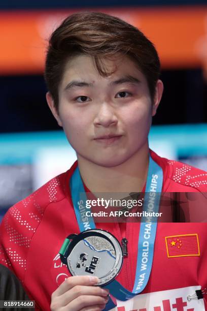 China's Si Yajie poses with her silver medal during the podium ceremony for the women's 10m platform final during the diving competition at the 2017...