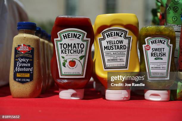 Condiments for hot dogs are on display during the American Meat Institute's annual Hot Dog Lunch in the Rayburn courtyard on July 19, 2017 in...