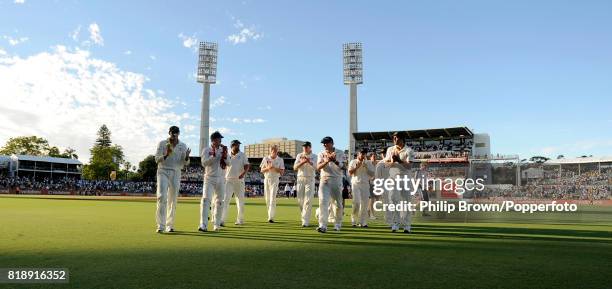 The Australian team walk off the field at the end of the 3rd day of the the 3rd Test match between Australia and England at the WACA, Perth,...