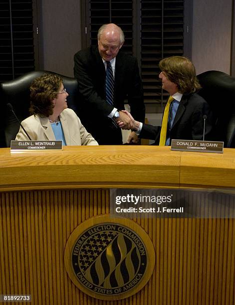 July 10: Commissioner Ellen Weintraub looks on as newly chosen Vice Chairman Steven T. Walther congratulates new Chairman Donald F. McGahn after the...