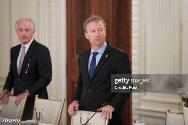 Sen. Rand Paul and Sen. Bob Corker attend a lunch with members of Congress hosted by US President Donald J. Trump in the State Dining Room of the...