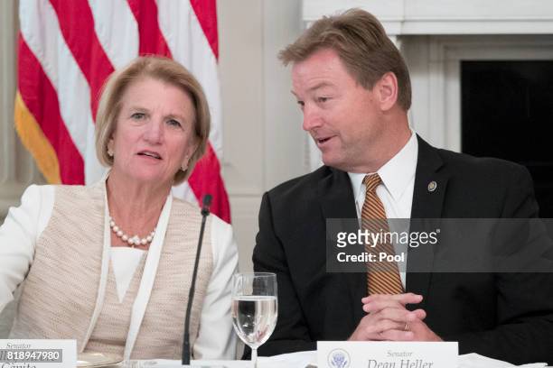Sen. Shelley Moore Capito and Sen. Dean Heller speak with one another before the start of a lunch with members of Congress hosted by US President...