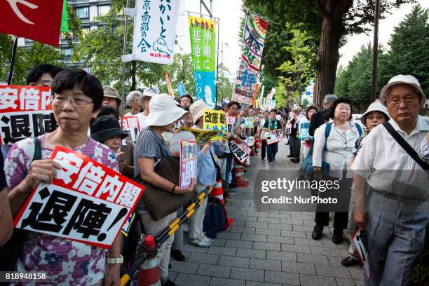 Anti-Abe protesters gather in front of the Tokyo parliament to protest against the policies of Shinzo Abe and to call on the Japanese prime minister...