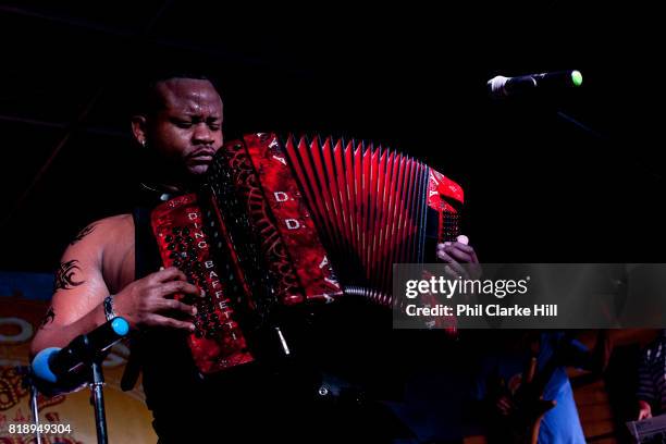 Zydeco music band playing with acordians, washboard and bass guitar, in New Orleans, Louisiana, USA. Walking down the street in the French Quarter,