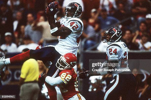 Safety Marcus Coleman of the Houston Texans intercepts a pass against the Kansas City Chiefs at Reliant Stadium in Houston, Texas on September 21,...