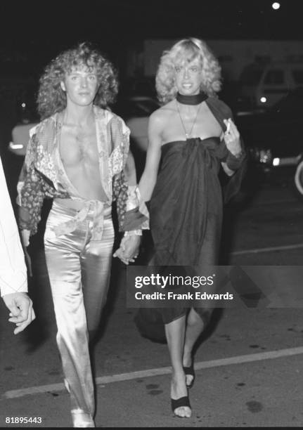 English singer, songwriter and guitarist Peter Frampton and girlfriend Penny McCall arrive at the Rock Music Awards at the Hollywood Palladium, Los...