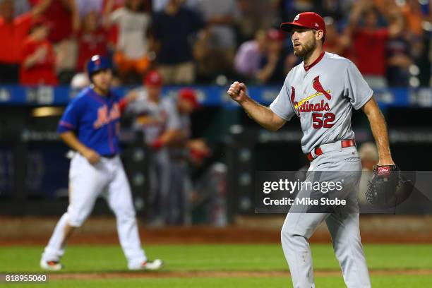 Michael Wacha of the St. Louis Cardinals pumps his fist after pitching a complete game 5-0 shutout against the New York Mets at Citi Field on July...