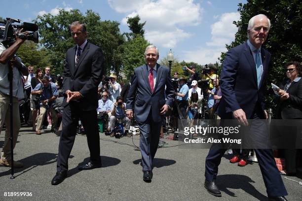 Senate Majority Leader Sen. Mitch McConnell , Senate Majority Whip Sen. John Cornyn and Sen. John Thune leave after they spoke to members of the...