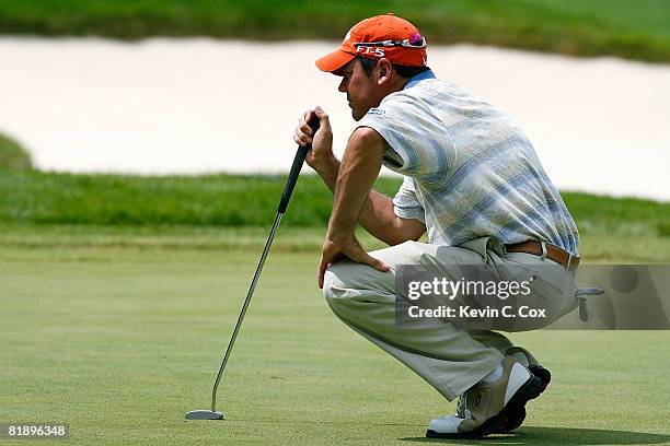 Rich Beem lines up a birdie putt on the first green during the first round of the 2008 John Deere Classic at TPC at Deere Run on July 10, 2008 in...