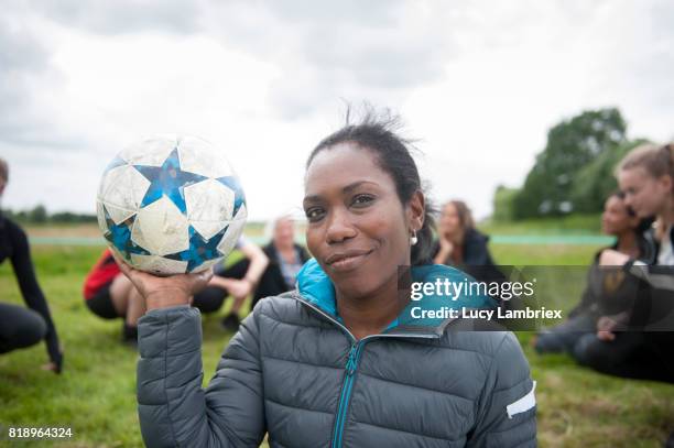 portrait of recreational female soccer player - leanincollection stockfoto's en -beelden
