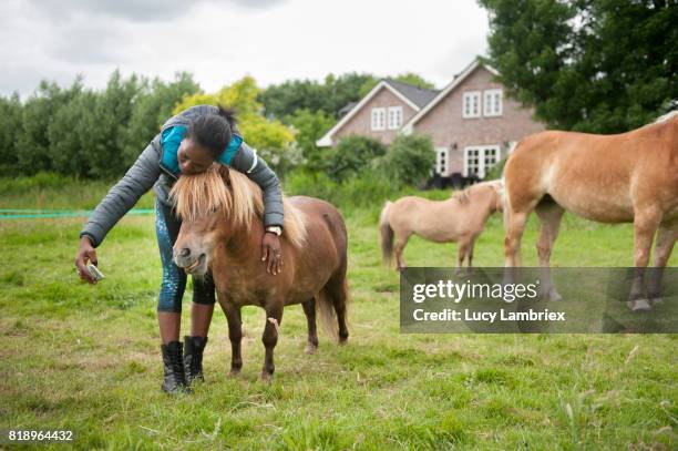 Woman taking a selfie with a pony