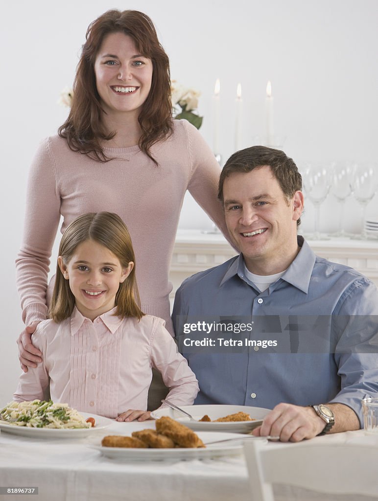 Portrait of family at dinner table