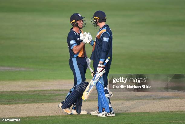 Billy Godleman congratulates Wayne Madsen of Derbyshire Falcons after he scores 50 runs during the NatWest T20 Blast match between Worcestershire...