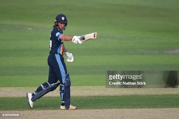 Wayne Madsen of Derbyshire Falcons raises his bat after scoring 50 runs during the NatWest T20 Blast match between Worcestershire Rapids and...