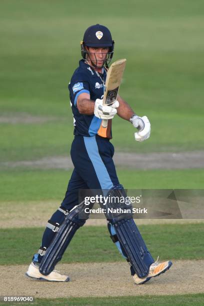 Wayne Madsen of Derbyshire Falcons raises his bat after scoring 50 runs during the NatWest T20 Blast match between Worcestershire Rapids and...