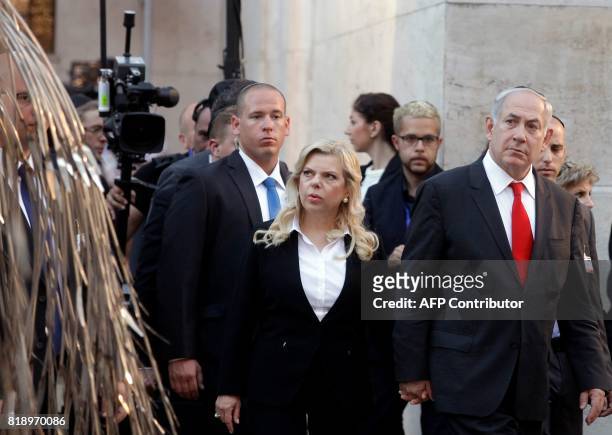 Israeli Prime Minister Benjamin Netanyahu and his wife his Sara read the names of the Hungarian Holocaust victims on the metal leaves of the 'Emanuel...