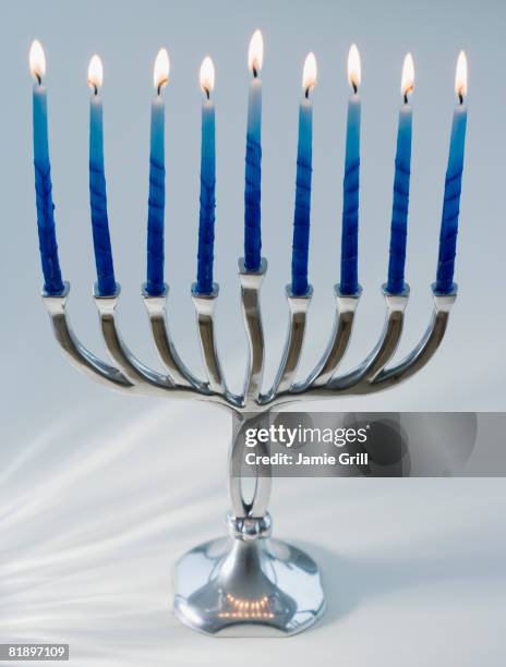 close up of menorah with lit candles - menorah stock pictures, royalty-free photos & images