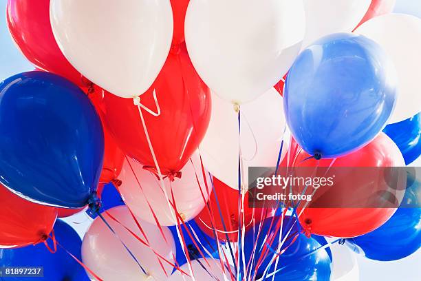 red, white and blue balloons - red balloons stock pictures, royalty-free photos & images
