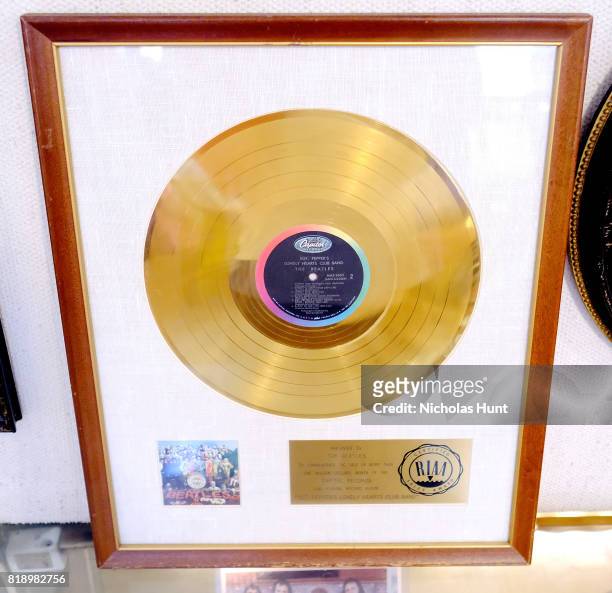 Beatles "Sgt. Pepper's Lonely Hearts Club Band" original RIAA white matte gold LP record album award presented to The Beatles for auction at Gotta...