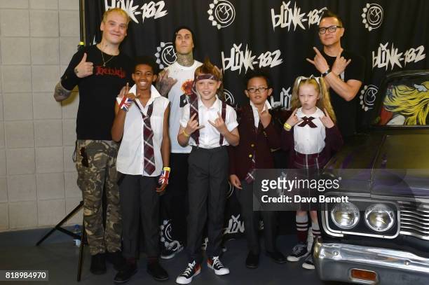 Matt Skiba, Travis Barker and Mark Hoppus of Blink-182 pose with "School Of Rock: The Musical" cast members Bailey Cassell, Toby Lee, Cole Lam and...