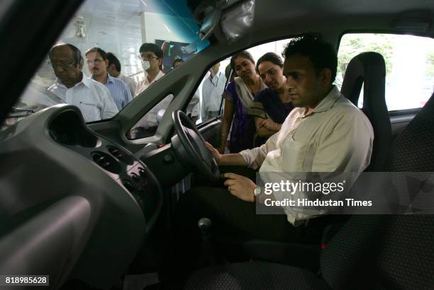 Three colleagues working at a nearby company used their lunch break on Wednesday afternoon to check out the Tata Nano on display for the first time...