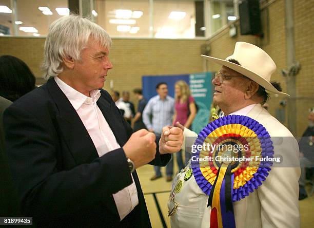Election candidate David Icke chats with Official Monster Raving Loony Party supporter Alan Hope during the count at the Haltemprice and Howden...