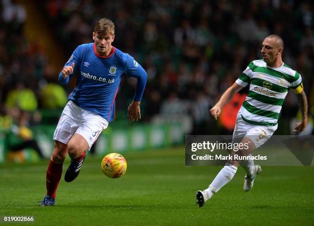 Cameron Stewart of Linfield takes on Scott Brown of Celtic during the UEFA Champions League Qualifying Second Round, Second Leg match between Celtic...