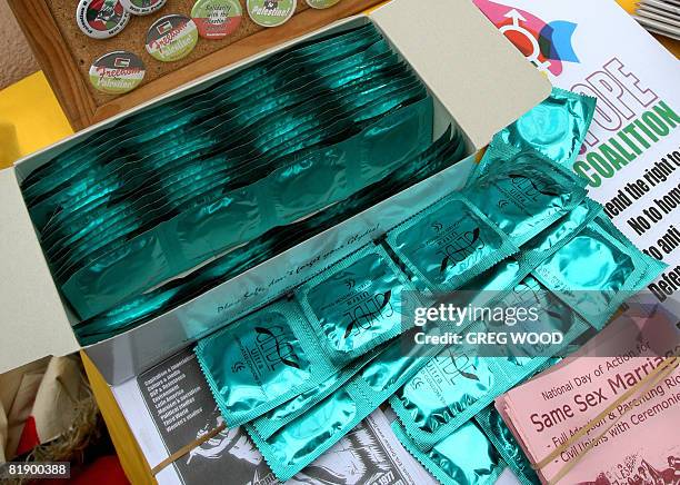 Condom packets are displayed at a NoToPope coalition "annoying" fashion show held outside the New South Wales state parliament on July 9, 2008 to...