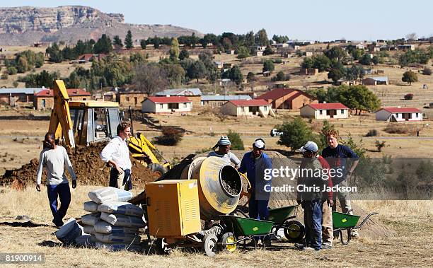 Prince Harry helps rebuild a school on July 8, 2008 in Buthe Buthe, Lesotho. Prince Harry and 26 soldiers from the Household Cavalry are in Lesotho...