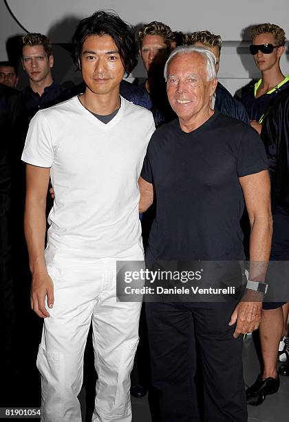 Actor Takeshi Kaneshiro poses backstage with Giorgio Armani after Emporio Armani fashion show as part of Milan Fashion Week Spring/Summer 2009 on...