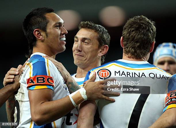 Jordan Rapana of the Titans is congratulated by team-mate Mat Rogers after scoring a try during the round 18 NRL match between the Sydney Roosters...