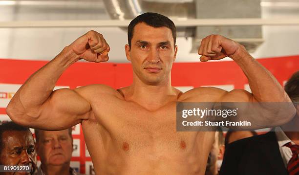 Wladimir Klitschko of Germany flexes his muscels during the public weigh in at a Karstadt sports shop on July 11, 2008 in Hamburg, Germany.