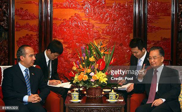 Mexican President Felipe Calderon meets with Chinese Premier Wen Jiabao during a meeting at the Zhongnanhai compound on July 11, 2008 in Beijing,...